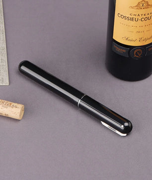 Sacacorchos portátil · Abridor de vino compacto en acero